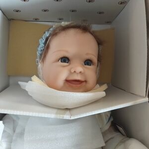 Smiling Baby Doll with Blue Eyes